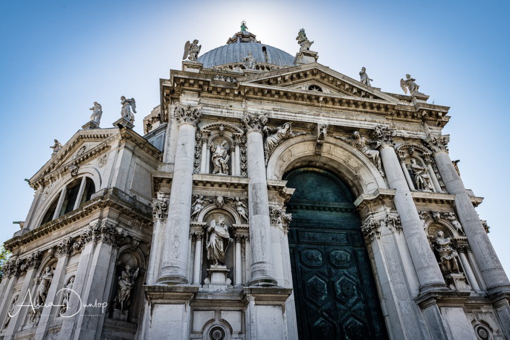 Sculptures adorn the external walls of Santa Maria della Salute - Venice in Spring series things to do in Venice